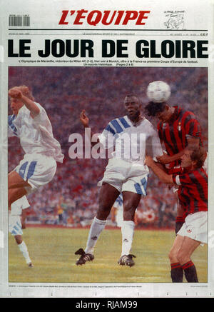 French publication 'L'Equipe' reporting the Marseilles Football club winning the UEFA Champions League in 1993. The highlight of the Marseilles football club's history was winning the new format UEFA Champions League in 1993. Basile Boli scored the only goal against Italy's Milan in the final held in Munich's Olympic Stadium. This triumph, however, was followed by a decade of decline. In 1994, due to financial irregularities and a match fixing scandal involving then president Bernard Tapie Stock Photo