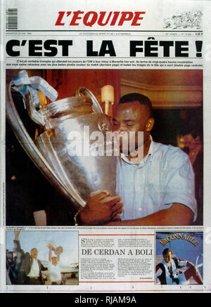 French publication 'L'Equipe' reporting the Marseilles Football club winning the UEFA Champions League in 1993. The highlight of the Marseilles football club's history was winning the new format UEFA Champions League in 1993. Basile Boli scored the only goal against Italy's Milan in the final held in Munich's Olympic Stadium. This triumph, however, was followed by a decade of decline. In 1994, due to financial irregularities and a match fixing scandal involving then president Bernard Tapie Stock Photo