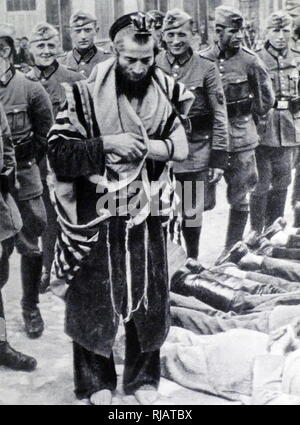 Anti-Semitic measures taken by German forces, during the Nazi Occupation of Poland, in World War Two. July 31, 1940; Olkusz, Poland, on “Bloody Wednesday”. A German police unit arrived, gathered all Jewish men in the main square and forced them to lie on the ground while the policemen and members of the SD “registered them”. They beat the Jews, shooting one. Rabbi Moshe Yitzhak Hagerman was forced to don his defiled tallit (prayer shawl) and tefillin (phylacteries) and stand barefoot and pray next to the prostrate men of the Jewish community. Stock Photo