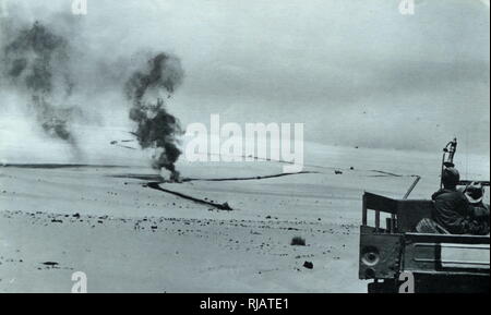 Israeli forces advance as Egyptian army tanks are destroyed in action in the Sinai Peninsula during the Six Day War 1967 Stock Photo