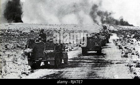 Israeli forces advance as Egyptian army tanks are destroyed in action in the Sinai Peninsula during the Six Day War 1967 Stock Photo