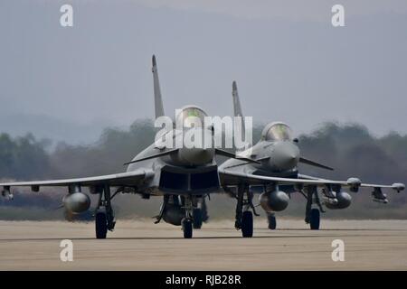 Two Royal Air Force Eurofighter Typhoon FGR4s taxi off of the runway after landing at Osan Air Base, Republic of Korea, Nov. 5, 2016. The arrival of the Typhoons marks the first time the RAF has fielded aircraft on the Korean Peninsula since 1956. Stock Photo