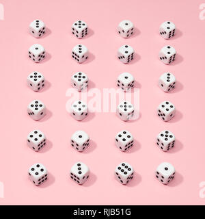 Square gaming dice pattern on pink background in flat lay style Stock Photo
