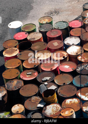 Rusty Empty oil barrels stored. Chemical drums. Oil industry Stock Photo
