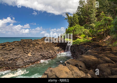 Little waterfall near the Queen's Bath of Kauai, Hawaii, USA Stock Photo