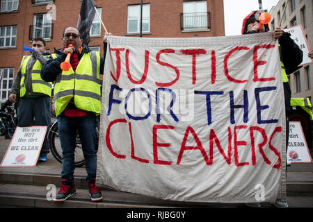 Cleaners demonstrate for a living wage as staff of Patisserie Valerie in Spitalfields on 8th December 2018 in London, United Kingdom. These cleaning workers were also protesting at the conditions within which they were working under. Stock Photo