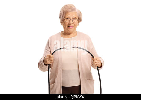 Senior woman holding a broken cable isolated on white background Stock Photo