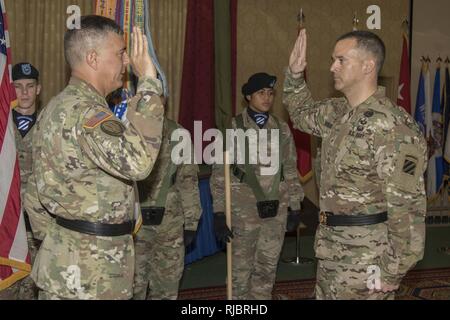 Lt. Gen. Stephen J. Townsend, commanding general, XVIII Airborne Corps, gives the oath of office to Brig. Gen. Sean C. Bernabe, commander, Task Force Marne, 3rd Infantry Division, during a promotion ceremony at Fort Stewart, Ga., January 11, 2018. Townsend also advised Bernabe, as a general officer, to always lead from the front and never have a bad day. Stock Photo