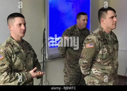 YAVORIV, UKRAINE -- Joint Multinational Training Group - Ukraine - Newly promoted 1st. Lt. Christopher McKay of Delta Company (FSC) is commended on his promotion by the Battalion Commander Lt. Col. William Murphy on 16 January 2018. Stock Photo