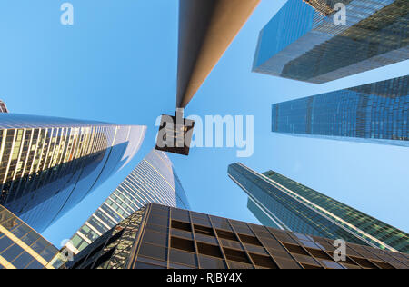 perspective bottom up view on business district skyscrapers Stock Photo