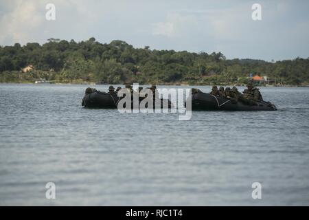 U.S. Marines demonstrate amphibious raids to Royal Cambodian Navy Sailors at Ream Naval Base, Sihanoukville, Cambodia, Nov. 2, 2016. U.S. Marines instructed the Cambodian Sailors on Combat Rubber Reconnaissance Craft (CRRC) operation and amphibious raids during Cooperation Afloat Readiness and Training (CARAT) 16. CARAT 2016 is a nine-country, bilateral exercise series between the United States and Bangladesh, Brunei, Cambodia, Indonesia, Malaysia, Singapore, the Philippines, Thailand, and Timor-Leste. This phase of CARAT focuses on partnerships between the forces of the US and Cambodia, and B Stock Photo