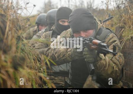 YAVORIV, Ukraine--Ukrainian Soldiers assigned to 1st Battalion, 80th Airmobile Brigade conduct an entering and clearing trenches exercise, Nov. 2, at the International Peacekeeping and Security Center. Soldiers assigned to 6th Squadron, 8th Cavalry Regiment, 2nd Infantry Brigade Combat Team, 3rd Infantry Division are currently responsible for training Ukrainian ground forces as part of the Joint Multinational Training Group-Ukraine. JMTG-U is training designed to reinforce defensive skills of the Ukrainian Ground Forces in order to increase their capacity for self-defense. ( Stock Photo