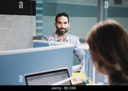Portrait Of Worried Business Man Looking At Camera In Coworking Office Stock Photo