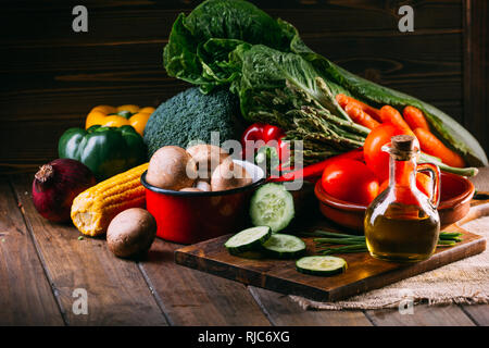 Vegetables and utensils on kitchen table Stock Photo