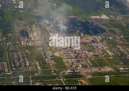 Top view of the industrial center of the city, factories and smoke pipes. Stock Photo