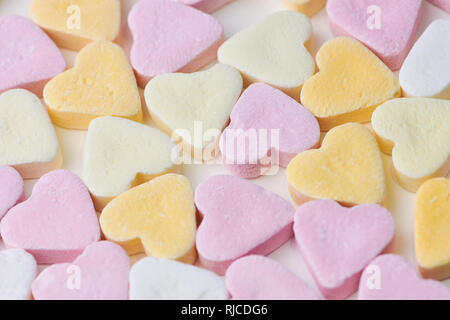 pastel colored candy hearts, macro photo as background picture Stock Photo