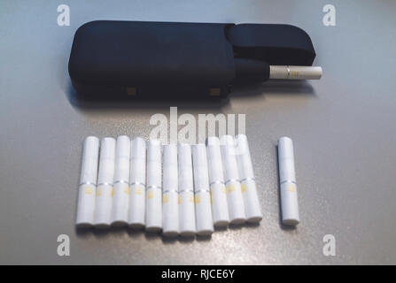 Download Tobacco Heating System And A Pack Of Tobacco Sticks On A Gray Background Stock Photo Alamy PSD Mockup Templates