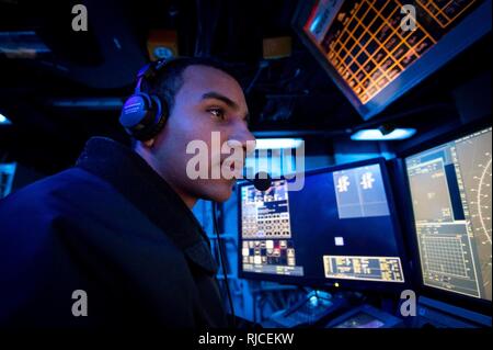 A Sailor stands watch in CIC Stock Photo: 54256144 - Alamy