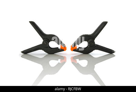 Plastic clamps for connecting parts on a white background Stock Photo