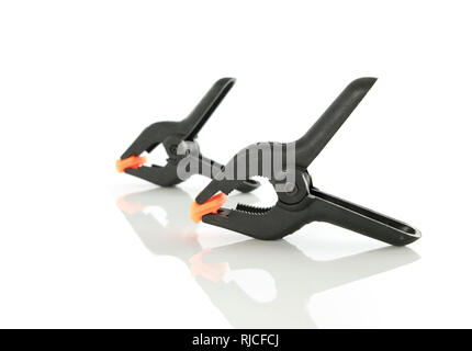 Plastic clamps for connecting parts on a white background Stock Photo