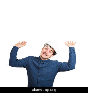 Engineer raising hands up look scared of something huge about to collapse on head. Male holding a heavy object about to squeeze him. Health and safety Stock Photo