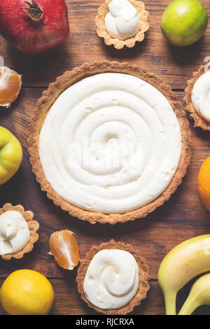 Preparing a fruit cake on rustic wooden table Stock Photo