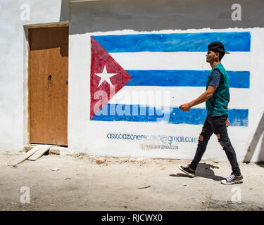 Man walking holding money, Havana, Cuba. Stock Photo