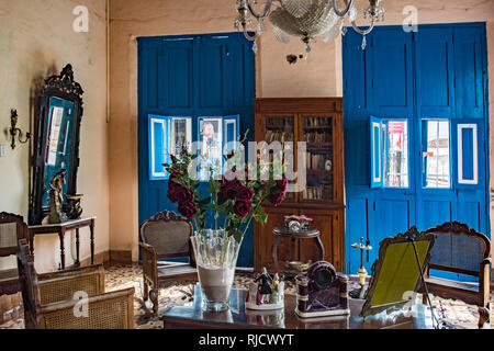 Casa room in Hostel Colonial Alelusa in Remedios, Cuba, Window frames Fidel Castro Stock Photo