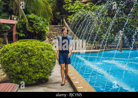 Swimming trainer in clothes for swimming, in the pool. Stock Photo