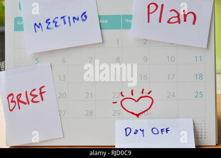 paper note for vacation remind stick on calendar Stock Photo
