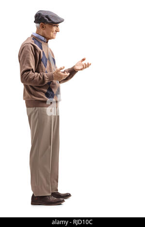 Full length shot of a senior man standing and gesturing a conversation isolated on white background Stock Photo