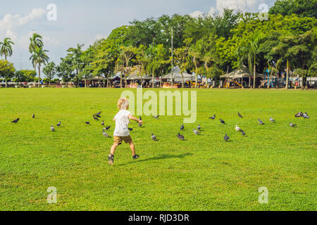 Boy on Padang Kota Lama or simply called The Padang, is the parade ground and playing field created by the British colonials in the civic district of  Stock Photo