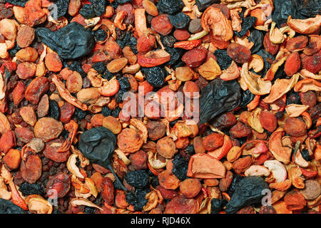 Healthy food. Background of dried fruit. A mixture of dried apricots, pears, raisins, apples, prunes Stock Photo