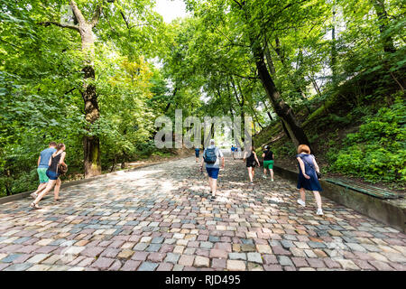 Lviv, Ukraine - August 1, 2018: Historic Ukrainian city in old town with colorful cobblestone alley path architecture and people during summer day to  Stock Photo