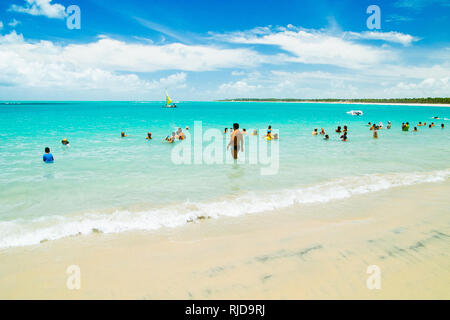 Porto de Galinhas, Brazil - February 24, 2009: People enjoying a hot day on the Fishing boat (Jangada) in Porto de Galinhas, Pernambuco, Brazil Stock Photo