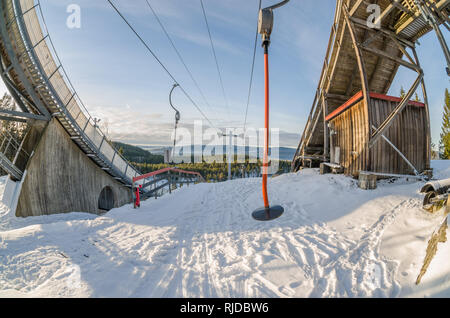 Oslo is surrounded by huge natural recreational area, perfect for all kind of winter freshair activity, eg. ski jumping. On photo:  platter lift betwe Stock Photo
