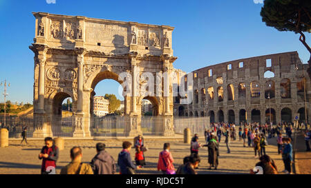 Tourists Visit Arch of Constantine and the Colosseum in Rome, Italy Stock Photo