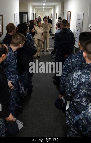 SASEBO, Japan (Jan. 18, 2017) Master Chief Navy Counselor Susan Garrow, Pacific Fleet Career Counselor, center, and Chief of Naval Personnel Vice Adm. Robert Burke, address Professional Apprenticeship Career Track Sailors during the Career Development Symposium at Commander Fleet Activities Sasebo. The symposium, hosted by Navy Personnel Command, is visiting Japan to reach out to Sailors and inform them of the benefits available from the personnel modernization initiatives of the Sailor 2025 program. Stock Photo