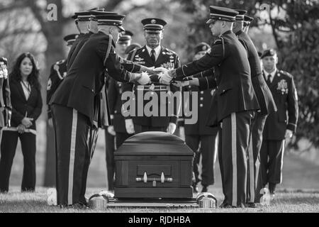 The U.S. Army Honor Guard, The 3d U.S. Infantry Regiment (The Old Guard) Caisson Platoon, and The U.S. Army Band, “Pershing’s Own”, conduct the funeral of U.S. Army Sgt. 1st Class Mihail Golin in Section 60 of Arlington National Cemetery, Arlington, Virginia, Jan. 22, 2018. Golin, an 18B Special Forces Weapons Sergeant assigned to 10th Special Forces Group (Airborne) died Jan. 1, 2018, as a result of wounds sustained while engaged in combat operations in Nangarhar Province, Afghanistan.  Golin deployed to Afghanistan in September 2017 with the 2nd Battalion, 10th Special Forces Group, in suppo Stock Photo