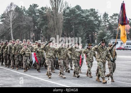 U.S. Soldiers from 5th Squadron, 4th Regiment, 2nd Armored Brigade Combat Team, 1st Infantry Division, march in formation during a farewell ceremony hosted by the Polish 10th Armored Cavalry Brigade in Swietoszow, Poland, Jan. 22, held to bid farewell to the squadron, as they transition their operations to Grafenwoehr, Germany for scheduled training. (Polish Land Forces Stock Photo