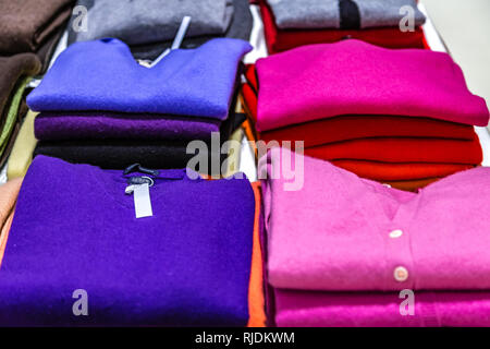 colorful Sweaters for sale in market Stock Photo