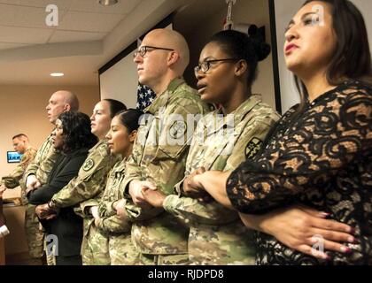 William Beaumont Army Medical Center Soldiers and staff join hands during a rendition of the gospel song “We Shall Overcome,” during the annual Martin Luther King Jr. Day observance at WBAMC, Jan. 19. The observance celebrated the life and accomplishments of Dr. Martin Luther King, Jr. and his impact on today’s culture. Stock Photo