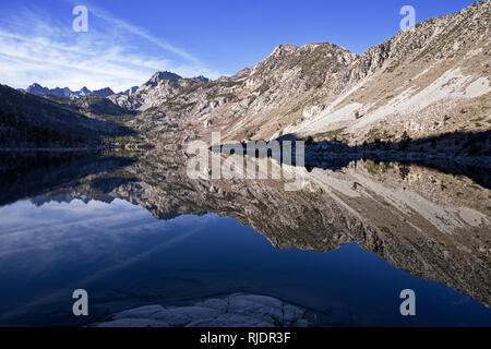 reflection of Sierra Nevada Mountains in Lake Sabrina near Bishop California Stock Photo