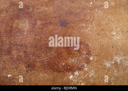 old distressed stained and scuffed leather background texture Stock Photo