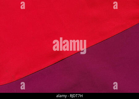 red and purple cloth sewed together with a diagonal background texture Stock Photo