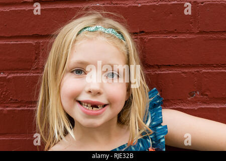 Young school age girl missing front tooth Stock Photo