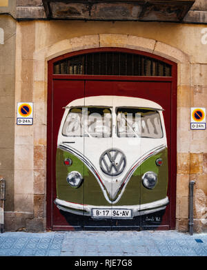 BARCELONA, SPAIN - JUN 1, 2018: Volkswagen vintage van painted on the door gate of a Barcelona house facade Stock Photo