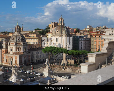 The capital of Italy, Rome. Trajan Column and Catholic churches from the Victor Emmanuel II monument. The Eternal Italian city in the summer evening. Stock Photo