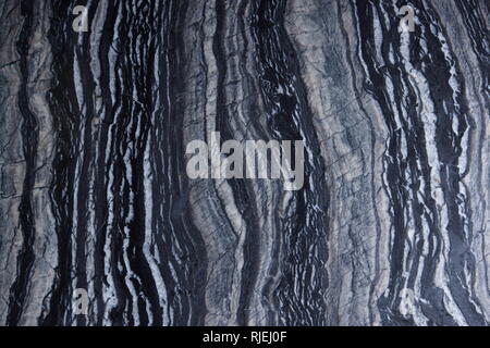 The texture of natural marble stone Silver Wave gray with patterns and black and white stripes. Stock Photo