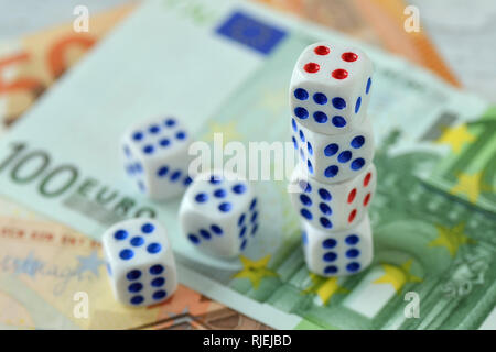 Dices on euro money background - Concept of risky investments and gamble Stock Photo